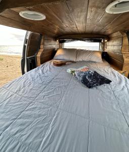a bed in the back of a van at HW Campervan Rental NO CAMPGROUND in Hauula