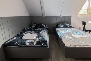Postel nebo postele na pokoji v ubytování Apartmány v lomnickém pivovaru