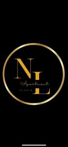 a gold logo with the letter n on a black background at NL Studio Apartments in Nevesinje