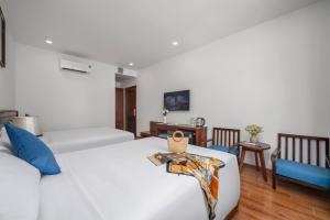 Postel nebo postele na pokoji v ubytování Sea Near Me Hotel Danang