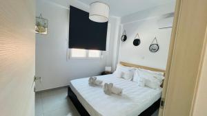 Postel nebo postele na pokoji v ubytování ATHINA