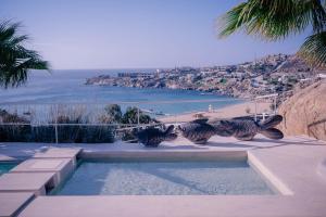 a swimming pool with a view of a beach at Super Rockies Resort in Super Paradise Beach