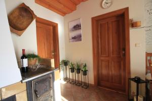 a room with a door and some plants on the wall at Eden guest house in Brezno