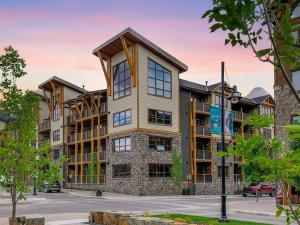 an exterior view of a large apartment building at Spring Creek Spacious Luxury & Views at White Spruce Lodge in Canmore