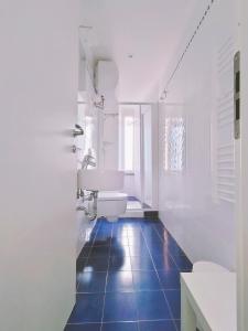 a bathroom with a white sink and a toilet at Belvedere Affittacamere in Corniglia