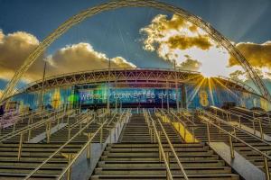 a view of a soccer stadium with stairs in front at Luxury Apt in Wembley Park Perfect for Events & Exploring London in London