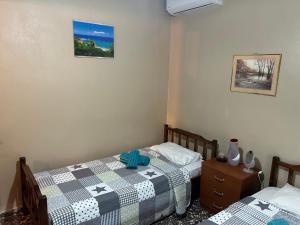 A bed or beds in a room at ''Mary's House'' Entire residence Olympiada Halkidiki Near to Sea 200m !