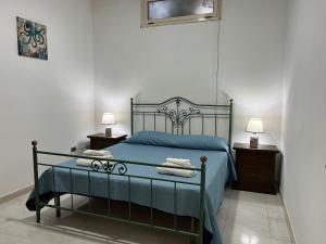 A bed or beds in a room at Residence Araba Fenice Tropea