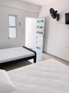 Katil atau katil-katil dalam bilik di Habitaciones coveñas