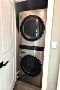 two microwaves sitting next to each other in a room at Spring Break Ready Arcade Foosball Sleeps 12 in Bolivar Peninsula