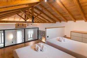 Posteľ alebo postele v izbe v ubytovaní MY Volissos Apartments + 37 fotografií