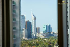 a view of a city skyline from a window at Dunya tower Royal suite Burj Khalifa street, Kings in Dubai