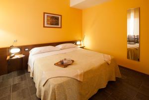 Postel nebo postele na pokoji v ubytování Hotel Mariani