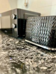 a laptop computer sitting on top of a counter at Departamento Entre Pinos in San Carlos de Bariloche