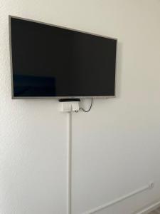 a flat screen tv hanging on a wall at Nauheim-Residenz in Bad Nauheim