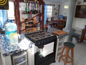 a kitchen with a stove and a counter top at casa de los abuelos in San Crisanto