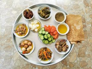 a plate of food with different types of food on it at Family House in Al Azraq ash Shamālī