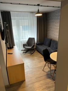 TV a/nebo společenská místnost v ubytování Guest Apartments Orłowo