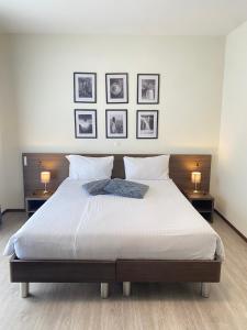 מיטה או מיטות בחדר ב-Hotel Locanda dei Mulini