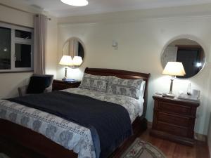 Postel nebo postele na pokoji v ubytování Woodhaven Manor h91rc9d