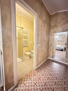 a bathroom with a shower and a toilet in a room at Villa Giovanna Citylife Milano in Milan
