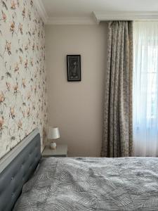 Postel nebo postele na pokoji v ubytování guest house TMT