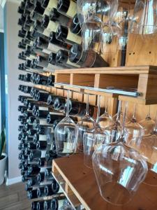 a wall of wine glasses in a wine cellar at Colchagua D'vino in Santa Cruz