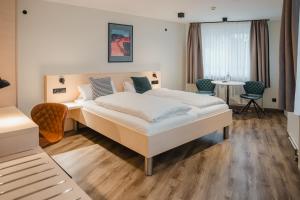 Postel nebo postele na pokoji v ubytování Hotel Restaurant Tychon AG + 37 fotografií