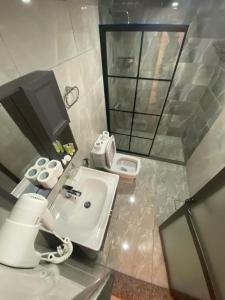 a bathroom with a sink and a toilet at Diamond Wadi Rum Luxury Camp in Wadi Rum