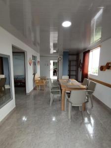 a dining room with a wooden table and chairs at Apartamento Esmeralda Arboletes in Arboletes