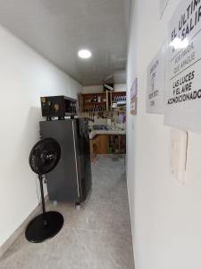 Kuchyň nebo kuchyňský kout v ubytování Apartamento Esmeralda Arboletes