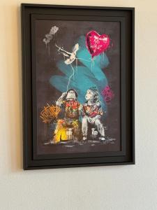 a framed painting of two people with a heart balloon at Jeanne d''Arc by Carl-Emilie in Épinal