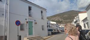 a group of people walking down a street at Casa Rural Recovecos in Algodonales