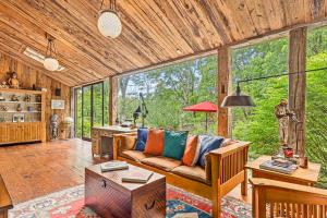 a living room with a couch and a table at Summer Rental Magical Converted Barn & Pool House in Pleasant Valley