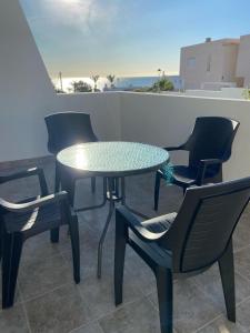 a table and chairs on a balcony with a table and chairs at Mojacar Luxury in Mojácar