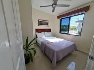 Postel nebo postele na pokoji v ubytování New Door Apartments