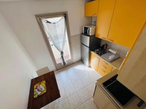 an overhead view of a small kitchen with a window at Studio 4 couchages à 200 m de la plage + garage in Juan-les-Pins
