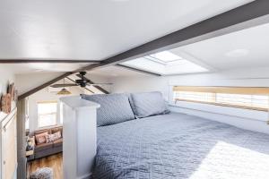a bedroom with a bed in a attic at Sun Catcher in Apple Valley
