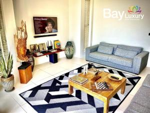 a living room with a couch and a table at Luxury Asian Flair Villa in Koh Phangan