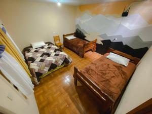 Postel nebo postele na pokoji v ubytování Golden Rest Latacunga