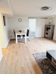 an empty living room with a table and chairs at Ferienwohnung Wehra in Wehr
