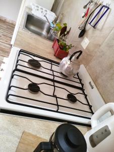 a stove top oven with a pot on top of it at ESTEPA CHIMEN in Río Gallegos