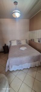 Ein Bett oder Betten in einem Zimmer der Unterkunft Pousada do Farol Bar e Restaurante