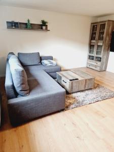 a living room with a couch and a table at Ferienwohnung Wehra in Wehr
