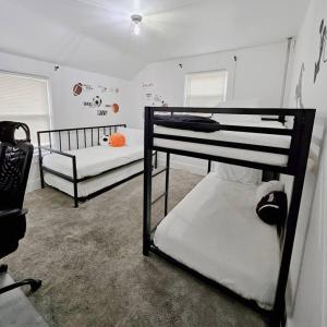 a bedroom with two bunk beds in a room at Sport Private Entrance, Near CP & SF, W/D, Pet OK in Sandusky