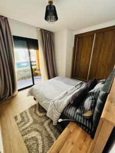 Cama ou camas em um quarto em Guéliz l’hivernage nour5