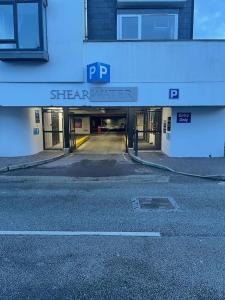 an empty street in front of a building at Marina Apartment Kinsale in Cork