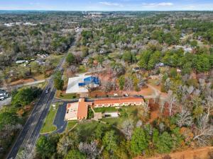 an aerial view of a house with a road and trees at Executive Inn in Rusk