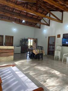 a large living room with chairs and a table at casa do lago, paz e sossego. in Guaramirim +28 photos