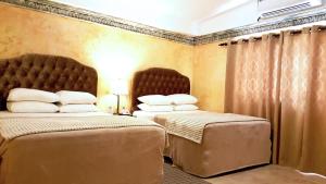Cama o camas de una habitación en Antigua Inn Hotel